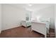 Cozy bedroom with two twin beds, soft carpet, and a bright, airy feel at 3512 Gibbon Terrace Ct, Charlotte, NC 28269
