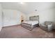 Comfortable main bedroom featuring vaulted ceilings, soft carpeting, and calming, neutral color palette at 3512 Gibbon Terrace Ct, Charlotte, NC 28269