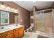 Bathroom featuring a double sink with white countertops and a glass-door shower at 3513 Briarcliff Acres Dr, Lincolnton, NC 28092