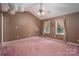Primary bedroom features vaulted ceilings, two windows, and pink carpeting at 3513 Briarcliff Acres Dr, Lincolnton, NC 28092