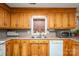 Traditional kitchen with honey oak cabinets, tile flooring, and stainless steel microwave at 3513 Briarcliff Acres Dr, Lincolnton, NC 28092