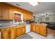 Traditional kitchen with honey oak cabinets, tile flooring, and stainless steel microwave at 3513 Briarcliff Acres Dr, Lincolnton, NC 28092