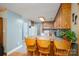 Open kitchen features seating at the breakfast bar, tile flooring, and neutral paint at 3513 Briarcliff Acres Dr, Lincolnton, NC 28092