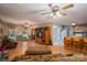 Open floor plan featuring living room and kitchen areas with hardwood floors and ceiling fans at 3513 Briarcliff Acres Dr, Lincolnton, NC 28092