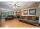 Spacious living room with hardwood floors, brick fireplace, and comfortable seating at 3513 Briarcliff Acres Dr, Lincolnton, NC 28092