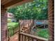 A backyard wooden foot bridge leads to the fenced in in-ground pool at 3513 Briarcliff Acres Dr, Lincolnton, NC 28092