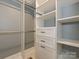 Bright closet with adjustable shelving, drawers, and rods to maximize organization and storage at 4000 Chandworth Rd, Charlotte, NC 28210