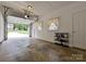 Spacious garage with an automatic door, offering ample storage space and featuring windows and a side door at 4000 Chandworth Rd, Charlotte, NC 28210