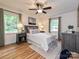 Comfortable main bedroom with hardwood floors and two windows providing natural light at 4000 Chandworth Rd, Charlotte, NC 28210