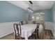 Charming dining room with wainscoting, modern light fixture, and space for entertaining at 4002 Paddle Wheel Ln, Indian Trail, NC 28079