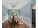 Serene dining room with a light fixture, beautiful views, and space for the whole Gathering at 4002 Paddle Wheel Ln, Indian Trail, NC 28079