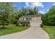 Charming two-story home featuring a well-manicured lawn, a front porch, and an attached two-car garage at 4002 Paddle Wheel Ln, Indian Trail, NC 28079