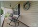 Charming front porch with rocking chairs and decorative wreath at 4002 Paddle Wheel Ln, Indian Trail, NC 28079