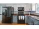 Well-equipped kitchen with stainless steel appliances, ample countertop space, and modern fixtures at 4002 Paddle Wheel Ln, Indian Trail, NC 28079