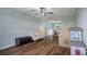 Inviting living area featuring hardwood floors, a neutral sofa and an adjacent dining area, perfect for Gathering gatherings at 4002 Paddle Wheel Ln, Indian Trail, NC 28079