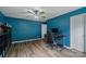 Well-lit office features a modern desk setup, offering an ideal blend of comfort and productivity at 4002 Paddle Wheel Ln, Indian Trail, NC 28079