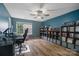 Functional home office with modern desk, shelves, and ample storage, creating the perfect workspace at 4002 Paddle Wheel Ln, Indian Trail, NC 28079