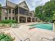 Lush backyard featuring a large pool, outdoor patio, and mature landscaping at 4290 Barbrick St, Sherrills Ford, NC 28673