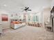 Bright, expansive bedroom with a daybed, comfortable sofa, and bay windows, creating a relaxing space at 4290 Barbrick St, Sherrills Ford, NC 28673