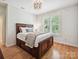 Bright bedroom with large window, hardwood floors, and neutral decor at 4290 Barbrick St, Sherrills Ford, NC 28673