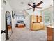 Cozy bedroom featuring a unique ceiling fan and charming wooden bookshelf for storage and display at 4290 Barbrick St, Sherrills Ford, NC 28673