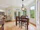 Cozy dining area featuring natural light from big windows and backyard views; modern lighting fixture at 4290 Barbrick St, Sherrills Ford, NC 28673