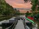 Scenic dock view with kayaks and paddle boards, offering direct access to the lake for recreational activities at 4290 Barbrick St, Sherrills Ford, NC 28673