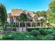 Beautiful lakefront home boasts mature landscaping and an inviting backyard pool at 4290 Barbrick St, Sherrills Ford, NC 28673