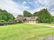Beautiful home with a large front lawn, mature trees, and a three-car garage at 4290 Barbrick St, Sherrills Ford, NC 28673