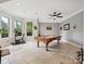 Well-lit game room with a pool table and exercise equipment, offering ample entertainment options at 4290 Barbrick St, Sherrills Ford, NC 28673