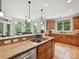 Bright kitchen featuring wooden cabinets, granite counters, stainless steel appliances, and hardwood flooring at 4290 Barbrick St, Sherrills Ford, NC 28673