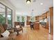 A spacious kitchen and breakfast nook, featuring hardwood floors and large windows with outdoor views at 4290 Barbrick St, Sherrills Ford, NC 28673
