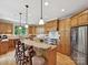Spacious kitchen with custom wood cabinets, stainless steel appliances, granite countertops, and eat-in island at 4290 Barbrick St, Sherrills Ford, NC 28673