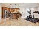 Functional kitchenette adjacent to exercise area equipped with modern appliances and a breakfast bar at 4290 Barbrick St, Sherrills Ford, NC 28673