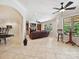 Open-concept living room with fireplace, tiled floors, and abundant natural light, perfect for gatherings at 4290 Barbrick St, Sherrills Ford, NC 28673