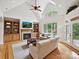 Open living room with fireplace, built-in shelving, large windows, and neutral decor at 4290 Barbrick St, Sherrills Ford, NC 28673