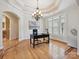 Home office featuring tray ceiling, large window, and hardwood floors at 4290 Barbrick St, Sherrills Ford, NC 28673