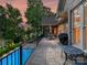 Spacious patio features stone floors, a pool, an outdoor kitchen, and a beautiful view of the lake at 4290 Barbrick St, Sherrills Ford, NC 28673