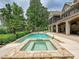 An inviting backyard pool and hot tub, surrounded by lush landscaping and a well-maintained lawn at 4290 Barbrick St, Sherrills Ford, NC 28673