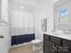 Compact bathroom with a shower-tub combo, dark vanity, and essential amenities, maximizing space efficiently at 435 Galbreath Ct # 128, Fort Mill, SC 29708