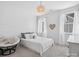Cozy bedroom with a queen bed, shiplap accent wall, and ambient lighting, creating a tranquil retreat at 435 Galbreath Ct # 128, Fort Mill, SC 29708