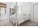 Serene bedroom with a four poster bed, soft natural light, and minimalist decor, ideal for rest at 435 Galbreath Ct # 128, Fort Mill, SC 29708