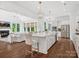 Open kitchen and living area featuring a large island, stainless steel appliances, and hardwood floors at 435 Galbreath Ct # 128, Fort Mill, SC 29708