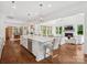 Open-concept kitchen with a large island and a seamless flow to the living and dining areas at 435 Galbreath Ct # 128, Fort Mill, SC 29708