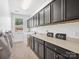 Well-organized laundry room with plenty of cabinet space, a utility sink, and washer/dryer, offering convenience at 435 Galbreath Ct # 128, Fort Mill, SC 29708