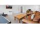 Open living room features a leather sofa, a coffee table and a large TV, perfect for relaxing or entertaining at 435 Galbreath Ct # 128, Fort Mill, SC 29708