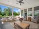 Well-appointed covered patio with ceiling fan, wicker furniture, and outdoor dining area, perfect for relaxing at 435 Galbreath Ct # 128, Fort Mill, SC 29708