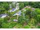Expansive home featuring a backyard pool, complemented by verdant greenery and mature trees at 509 N Oak St, Lincolnton, NC 28092