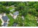 Spacious property featuring a pool, lush landscaping, and a charming two-story home surrounded by mature trees at 509 N Oak St, Lincolnton, NC 28092