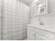 Bathroom featuring bead board, single vanity, shower with curtain, and tiled floors at 509 N Oak St, Lincolnton, NC 28092